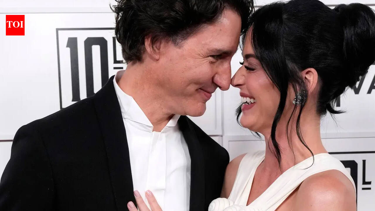 Katy and Justin share a passionate kiss on beach date - PICS