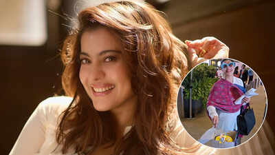 Kajol cuts birthday cake with paps at airport, shy Nysa Devgn stays out of frame
