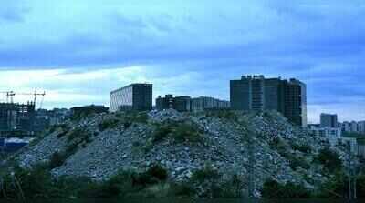 Mountains of debris rise beside hospitals in Hyderabad’s Hi-Tec City