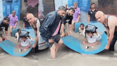 Watch: Locals use makeshift raft to ferry schoolkids through flooded Delhi streets