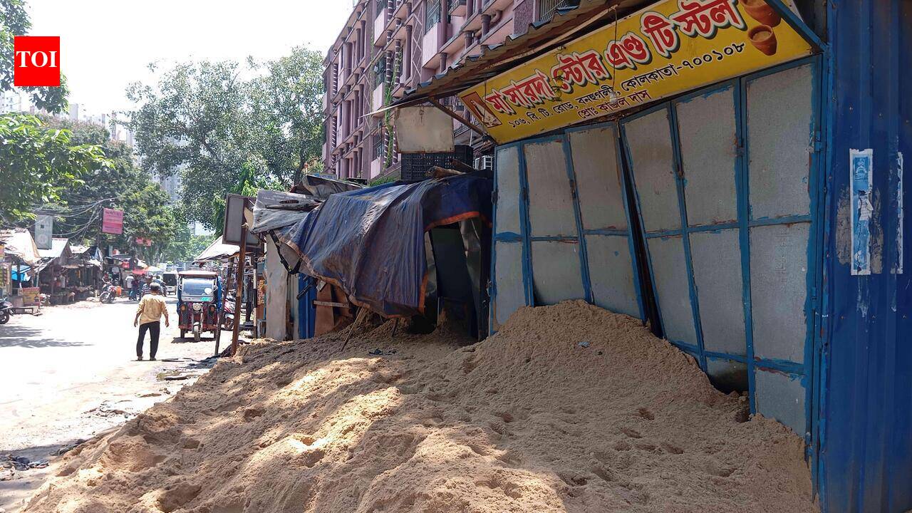Truck overturns, damages shops on BT Road