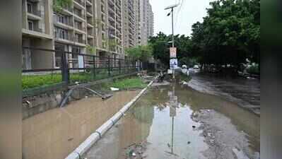 Dotted with condos, but Sector 150 pockmarked with broken roads, potholes, garbage heaps