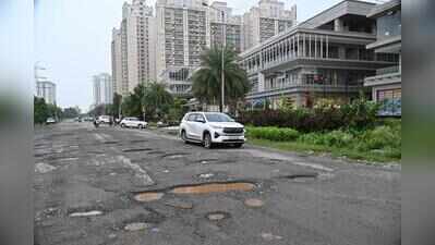 Dotted with condos, but Sector 150 pockmarked with broken roads, potholes, garbage heaps