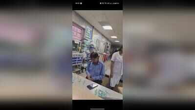 Guard fills syringes for emergency patients at district hospital