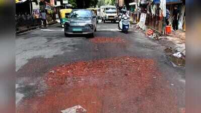 Traffic slows down as potholes show up after rain
