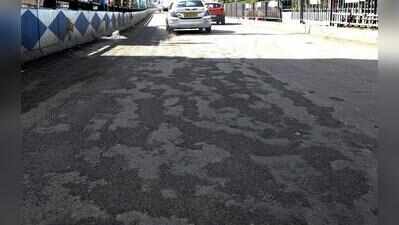Traffic slows down as potholes show up after rain