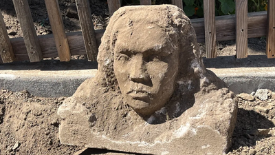 A San Francisco man was digging in his backyard when his shovel hit something hard; he unearthed a 150-pound limestone sculpture and nobody knows who made it