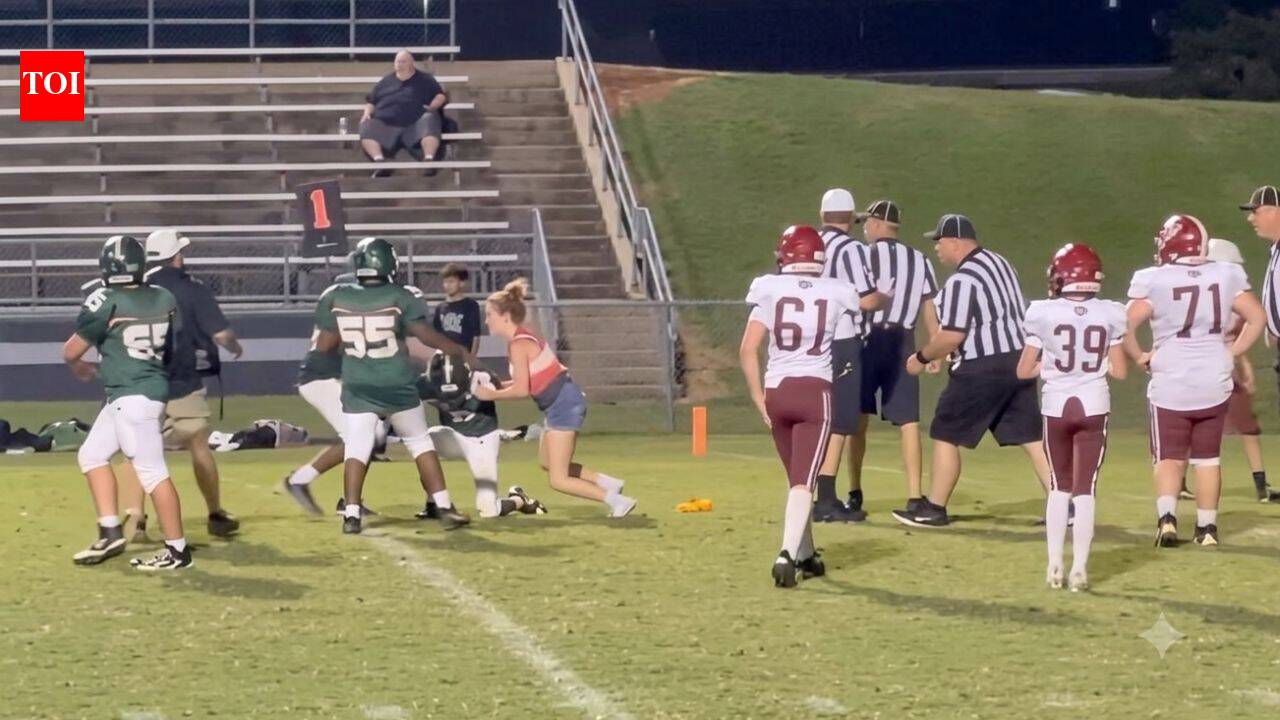 16-year-old girl runs onto field to tackle player and protect brother during game — watch