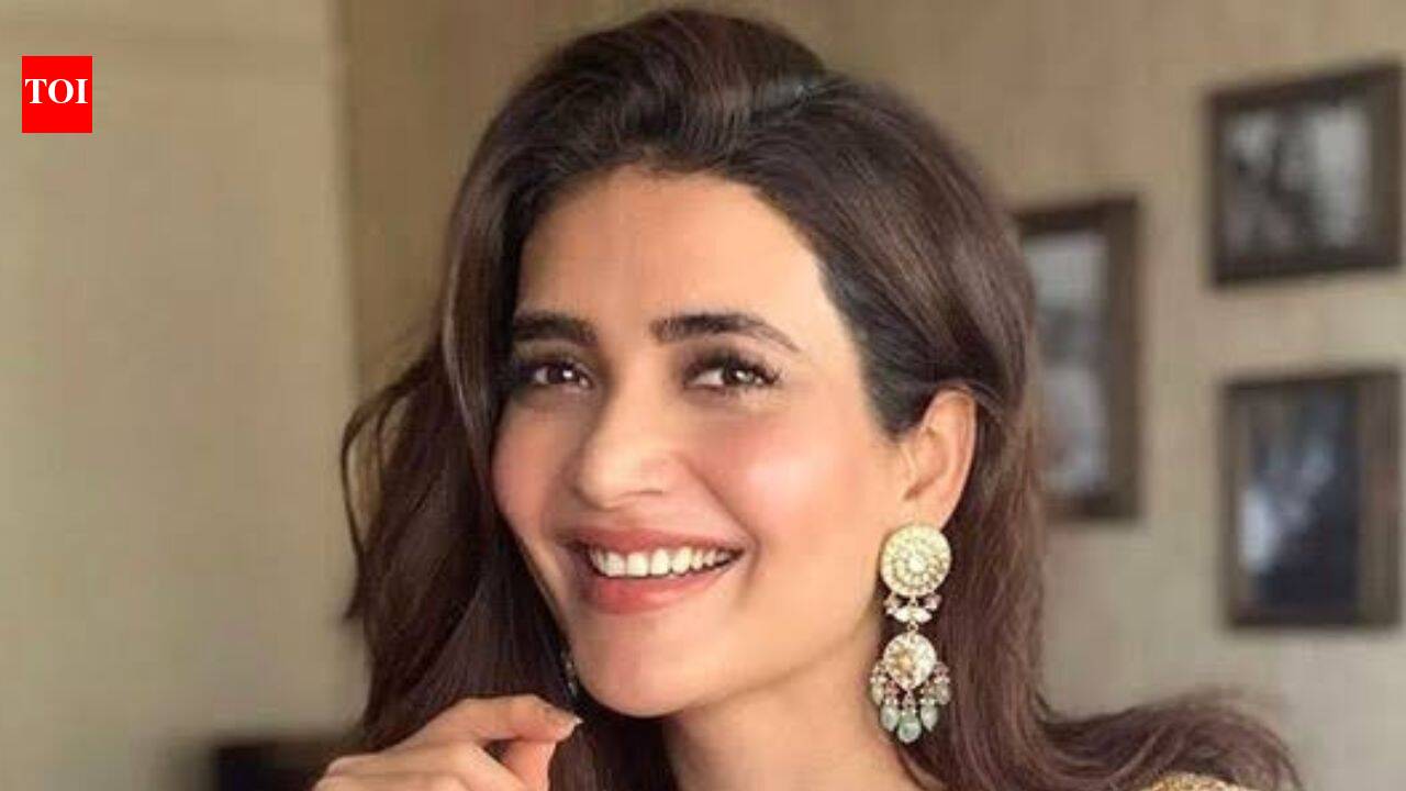 Karishma Tanna smiling, looking healthy and content as a new mother discussing postpartum life.