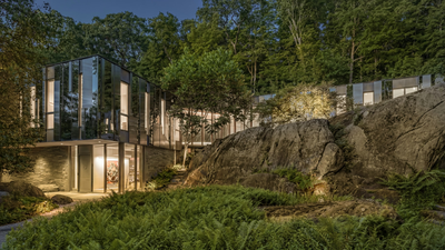 Built to reflect the trees around it, this 19.5-acre New York home almost disappears into the forest; the striking property is now on the market for $15 million