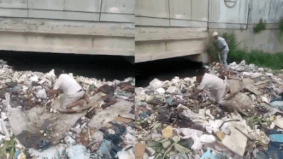 Watch: Father searches open drain  for missing son, 15-year-old later found dead in Delhi