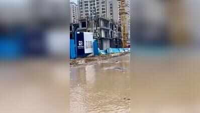 Lined with condos, even light rain floods roads here