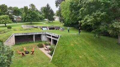 Built for $70,000 in 1976, this underground Missouri concrete home survived a deadly F4 tornado; 50 years later, it remains almost invisible from the road, hidden beneath a hillside