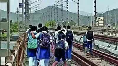 No road link, Palghar island children forced to walk on railway tracks to reach school