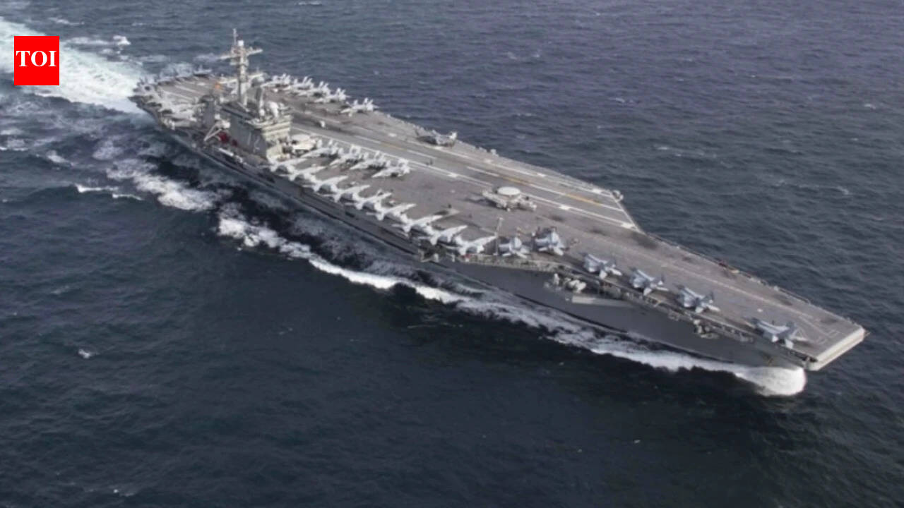 USS Abraham Lincoln sails past Singapore on way home after gruelling Middle East deployment