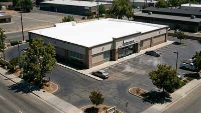 In 2002, a Sacramento retail store added a cool roof; peak surface temperatures fell 33-42 K, and air-conditioning energy dropped 52% on hot days