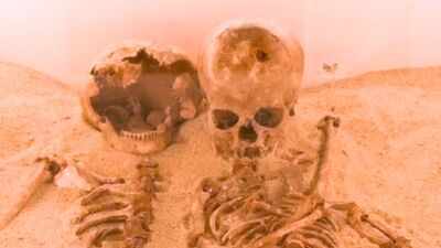 12,000-year-old skeletons buried in an embrace in Italy were women, with ancient DNA revealing a mother-daughter link and rare genetic disease