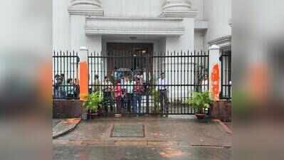 Protesters smear saffron paint on newspaper office gates