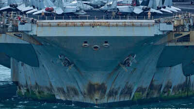 Rust streaks, faded paint and 5,000 tired sailors: War-weary USS Lincoln docks in Thailand