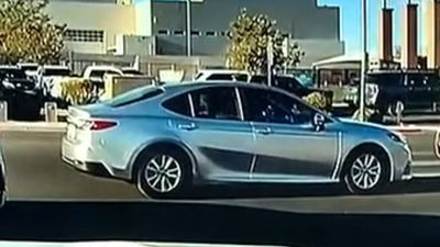 A Las Vegas crossing guard steps in front of speeding car as it bears down on mother, 2 children; came within 10 feet