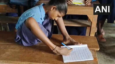 Born without both hands, 13-year-old Lakshmi writes with her feet to stay in school; the Bihar student now dreams of becoming a teacher