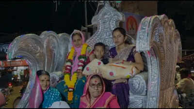 After 200 years, family welcomes a baby girl with a royal celebration in a golden chariot, with drum beats and vivid procession; grandmother calls her 'Laxmi Devi'