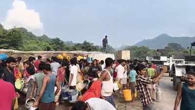 Villagers rush to collect oil after tanker overturns
