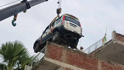 Worried about theft, Bihar family parks new SUV on rooftop with crane
