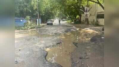 No drainage system, commute on pothole-ridden access road a regular ordeal