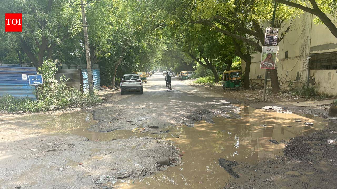 No drainage system, commute on pothole-ridden access road a regular ordeal