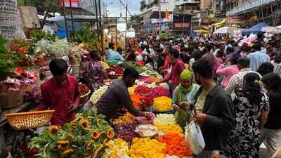 Colour, scent of flowers fill markets, demand during puja increases cost