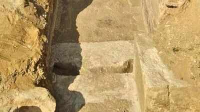 Egyptian archaeologists uncovered a tomb at Saqqara with 3 sealed sarcophagi and more than 100 figurines from later burials