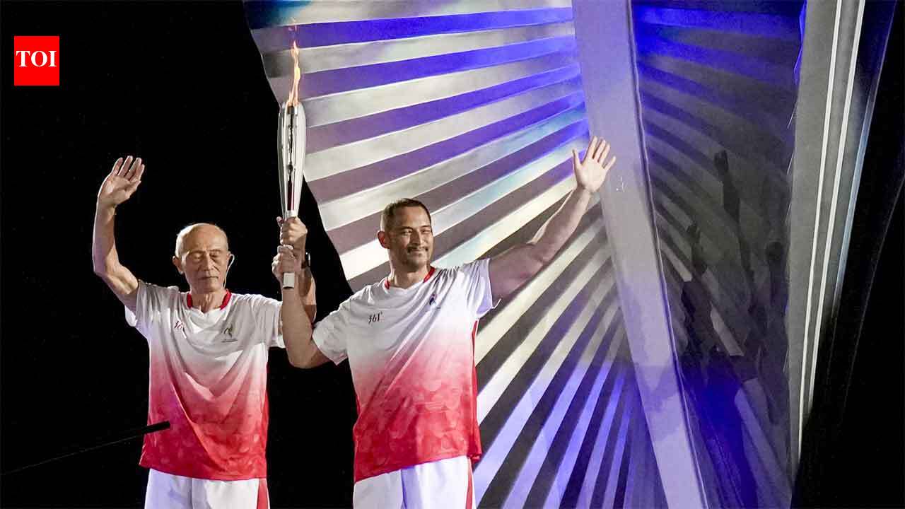 Father-son duo makes history: Five-time Asian Games champion Shigenobu Murofushi and Olympic gold medallist son Koji light cauldron in Aichi-Nagoya