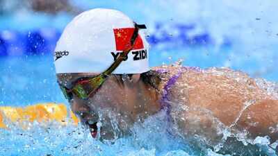 China's 13-year-old swimmer Yu Zidi clocks 2:05.08 to break Asian Games record, wins 200m butterfly gold; she also became youngest medallist in World Championships swimming history in 2025