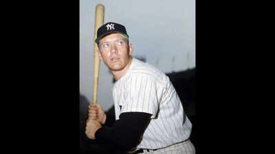 A couple found a rare Mickey Mantle photo inside a baseball book at a garage sale; it later sold for $20,740