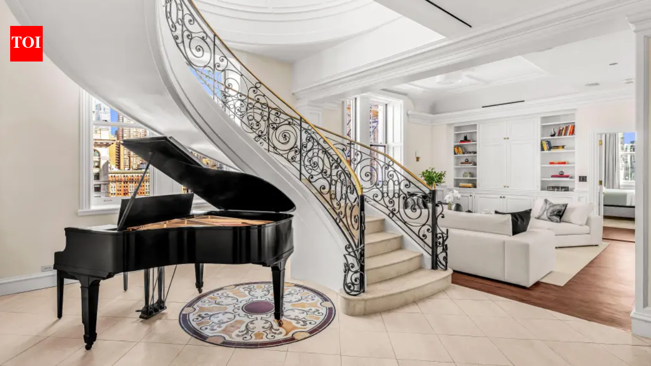 A gold-domed New York City penthouse first listed for $25 million has sold for $9 million