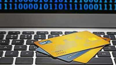 A North Carolina fraud scheme used stolen identities to request replacement bank cards and spend more than $650,000; one man has now been sentenced to 15 months and ordered to pay $656,781 in restitution