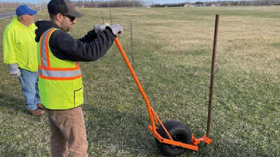 A New York highway superintendent built a snow-fence pole remover from an old golf-cart wheel and scrap box tubing for $0; it cut a three-week job to about 1.5 weeks and has now won a national federal award