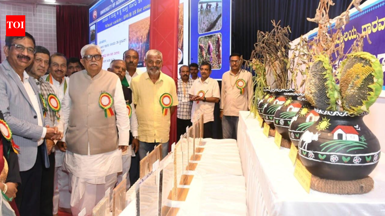 Farmers and visitors interacting with agricultural technology and livestock exhibits at the UAS Dharwad Krishi Mela.