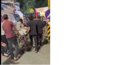 Crowds make way for ambulance near Alka Talkies Chowk, soundbox-laden trolley blocks access to hospital