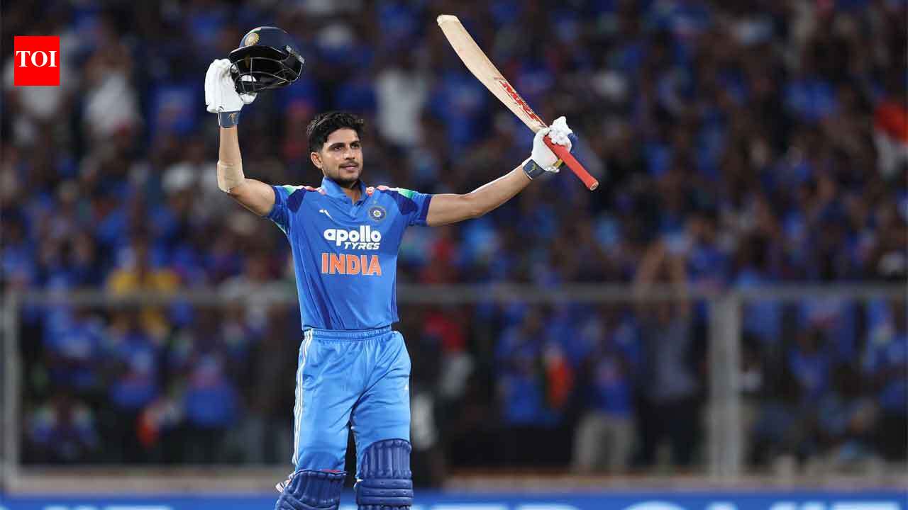 Shubman Gill raises his bat after scoring his 10th ODI century