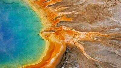 Yellowstone rangers remove 20,100 pieces of trash from geothermal areas in 2026, including more than 5,000 rocks and sticks, 280 visitor hats and over $18 in coins
