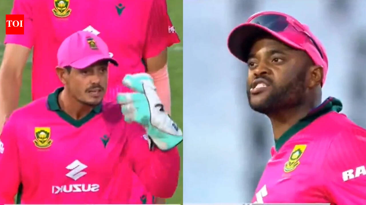 Temba Bavuma and Quinton de Kock exchange during review