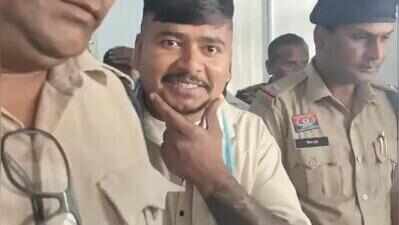 Chilling grin of man accused of killing cop’s wife, daughter outside court after he gets 10 yrs in jail
