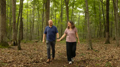 In 2022, a Connecticut couple bought a cottage on 50 acres and built forest trails; after charging visitors to walk there, they faced a zoning dispute and are fighting to reopen their land to hikers