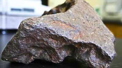 A 10.22-kg rock used as a Michigan barn doorstop for decades was identified as a new iron meteorite