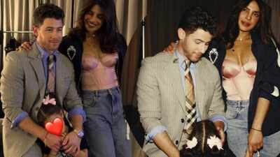 Nick Jonas, Priyanka Chopra and Malti Marie pose together for the perfect family photo while on tour with the Jonas Brothers