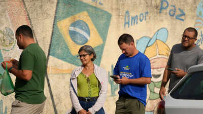 Brazil election: Lula, Flavio Bolsonaro head to runoff after tight first-round vote