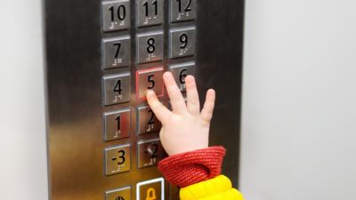 Psychology says children who always want to be the one pressing the lift button may be seeking more than just a turn