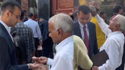 Before son’s big UPPSC interview, father fixes his coat, combs his hair and feeds him sweets; viral video melts hearts